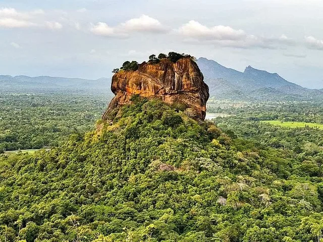 Aerial view of Sigiriya rock surrounded by lush green jungle